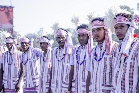 Tribal male artist in white dress