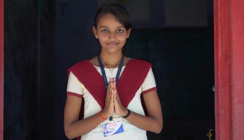 A student holding hands