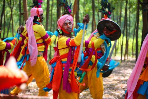 A group of artist performing paika dance