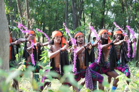 Group of the male artists performing shikari dance in