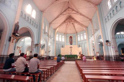 Sited people inside the church