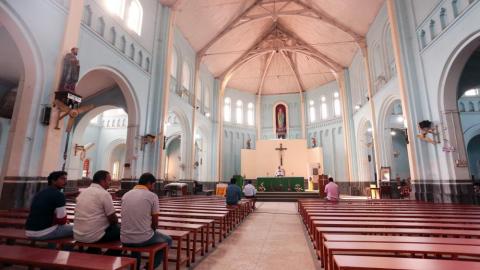 Sited people inside the church