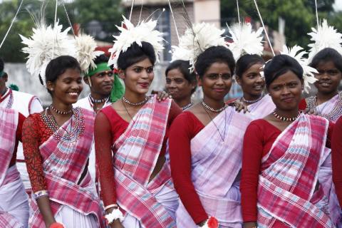 Tribal women getting ready for dance during karma puja celebration