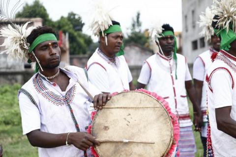 Tribals getting ready for dance during karma puja celebration