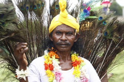 Tribals getting ready for dance during karma puja celebration