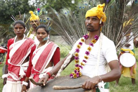 Tribals getting ready for dance during karma puja celebration