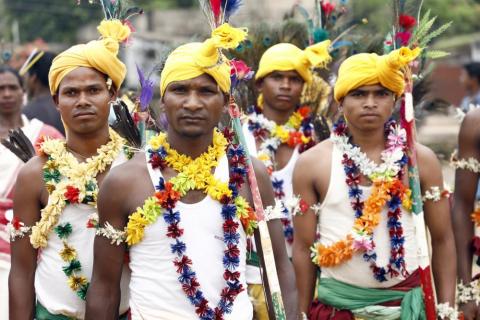 Tribals getting ready for dance during karma puja celebration